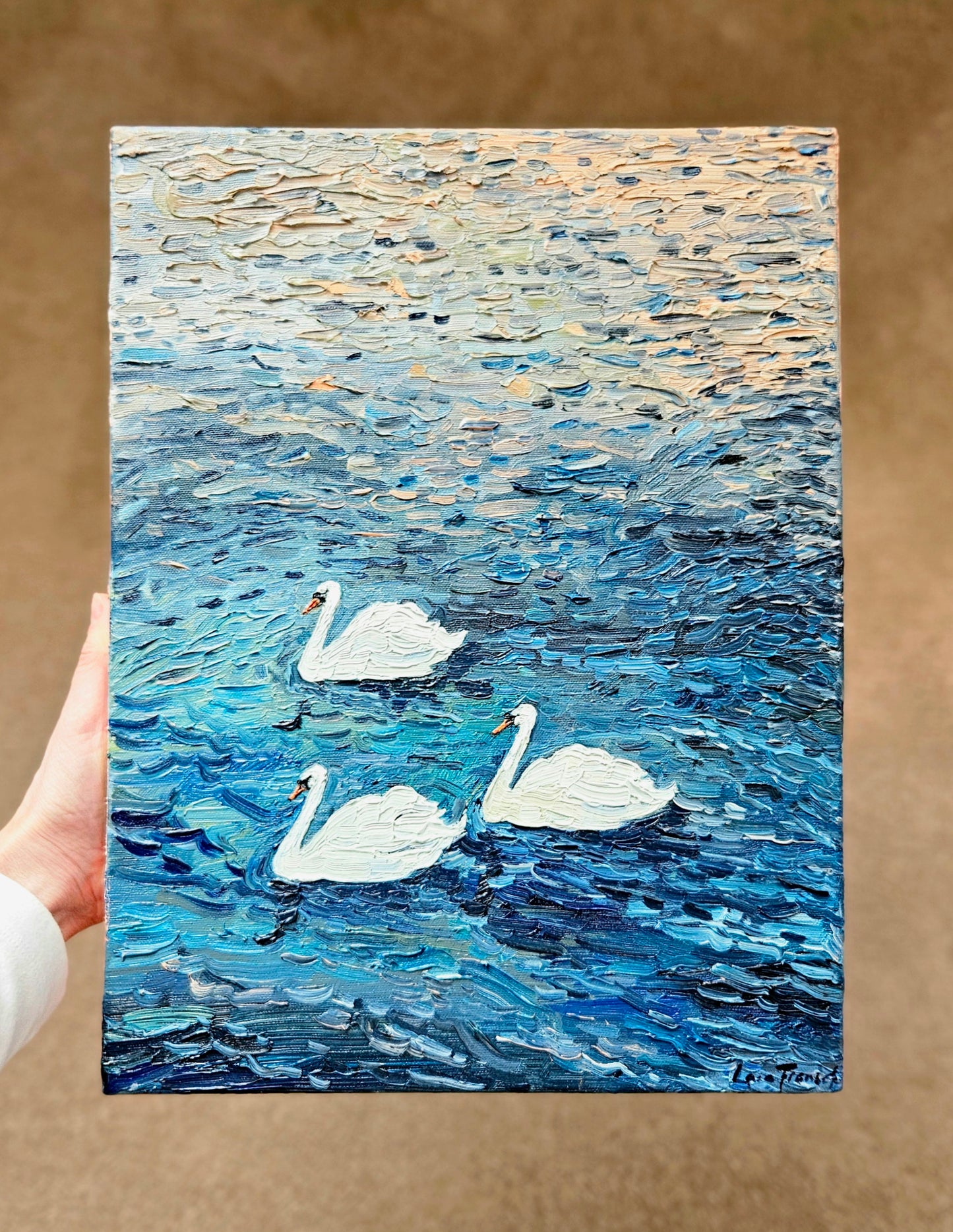 3 drifting swans