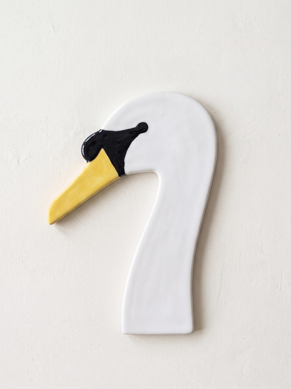 white swan (yellow beak)